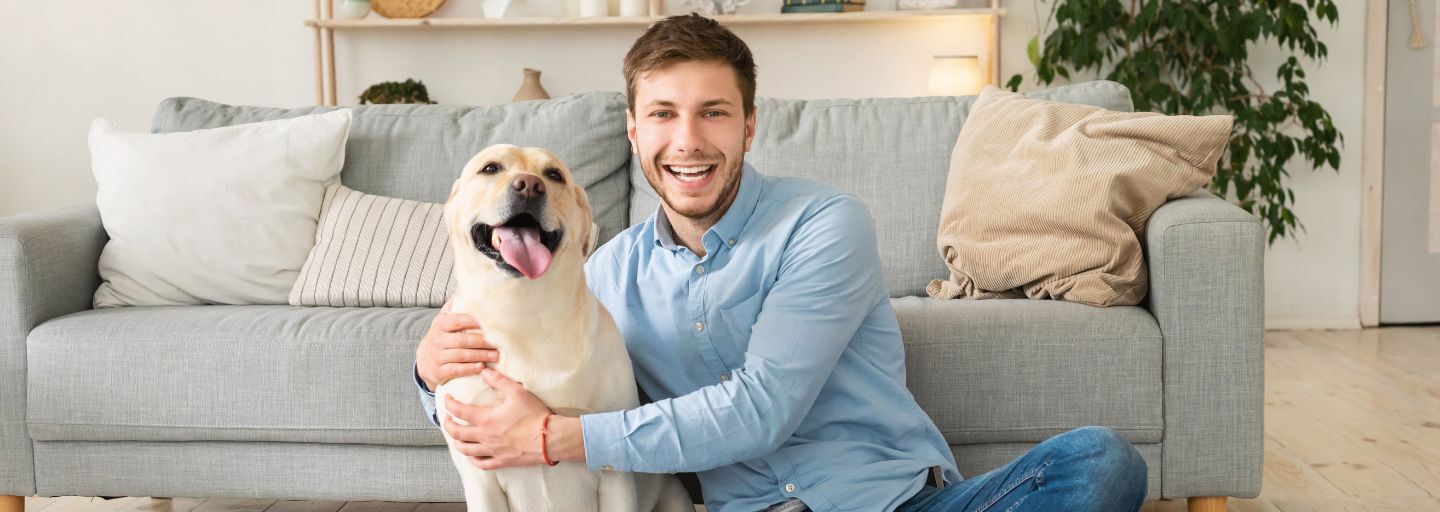 Dog and Owner sitting happily together in the lounge room