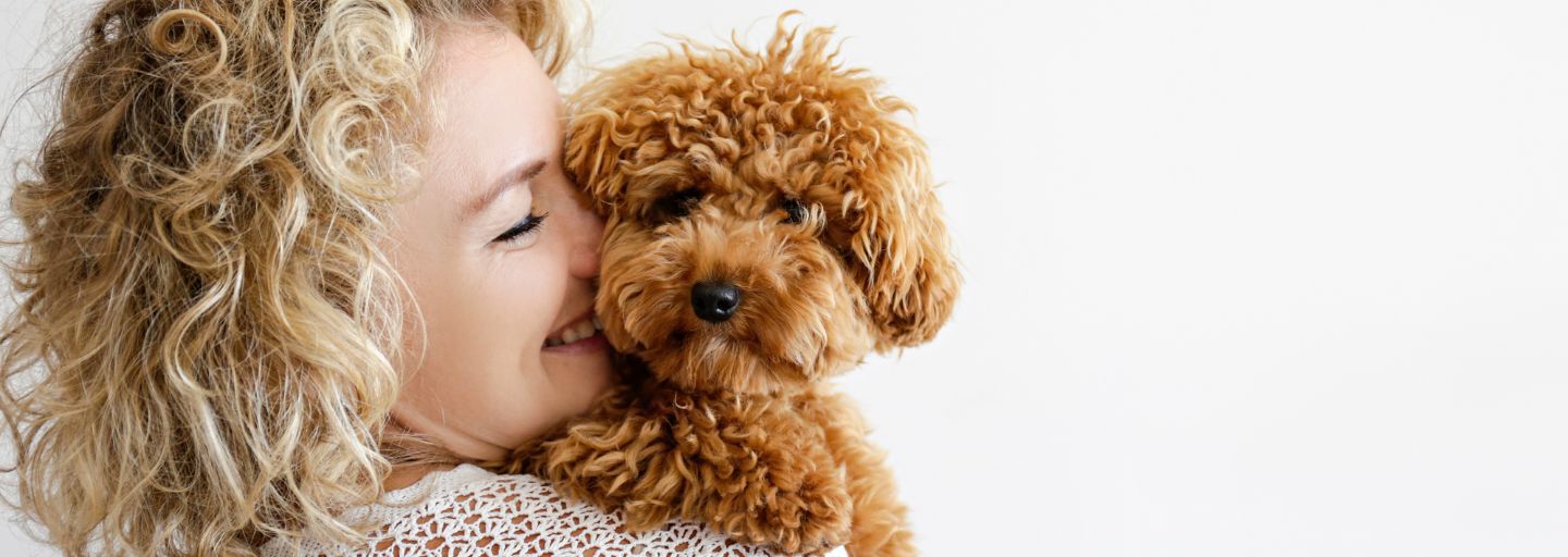 Owner and New Puppy Embracing