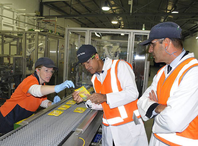 two employees at a factory